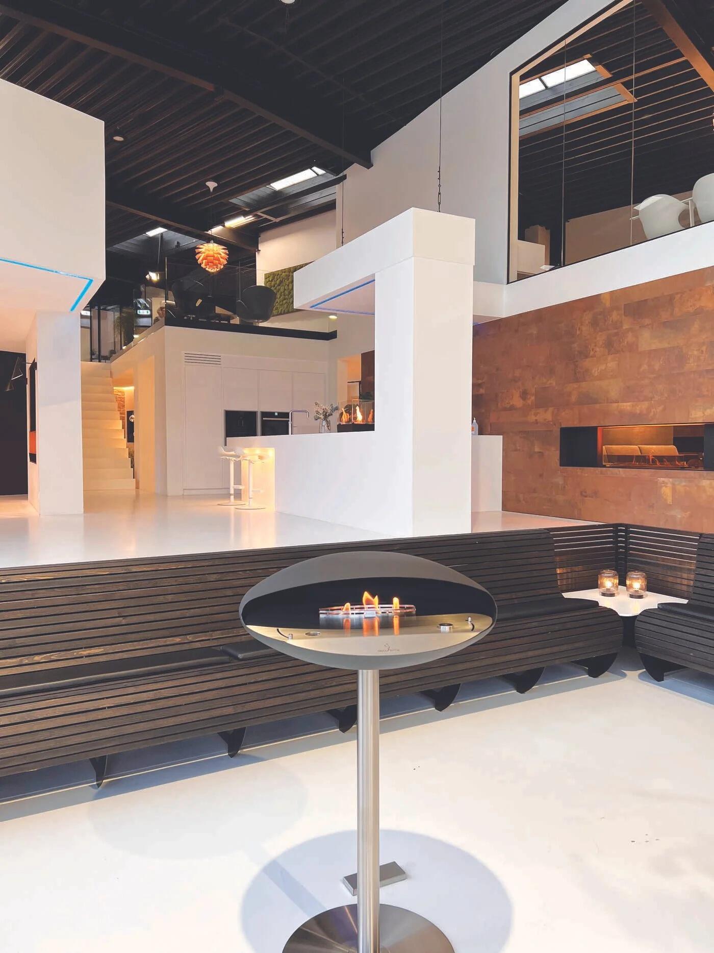 Espoo bio-ethanol fire on a steel pedestal foot in a modern interior