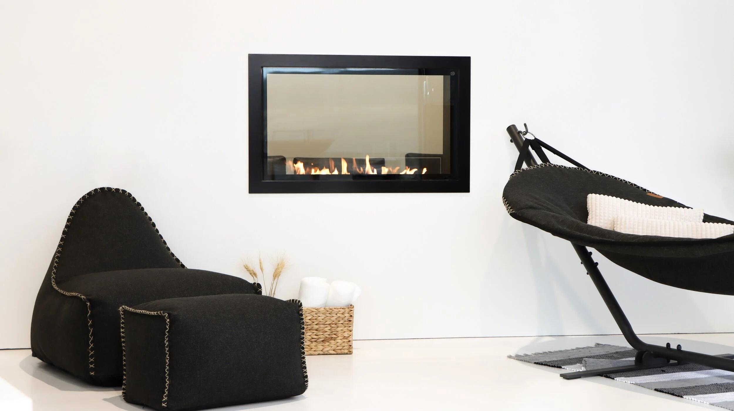 Montreal Clear fire in a white wall above a lounge seat