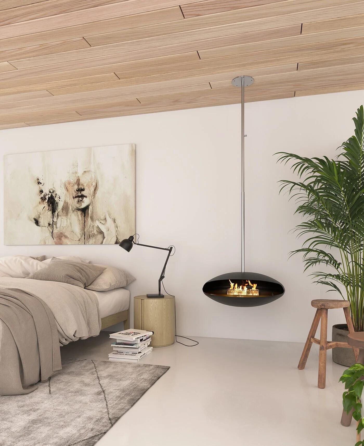 Espoo ceiling-hung fire in a bedroom with a timber ceiling