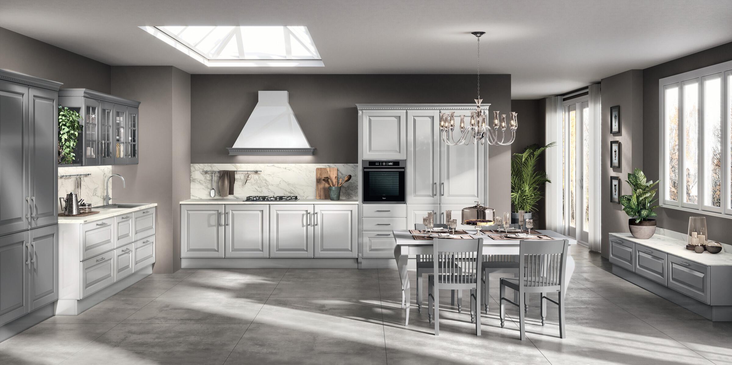 Scavolini Baltimora kitchen in light grey with a canopy hood, dining table and skylight