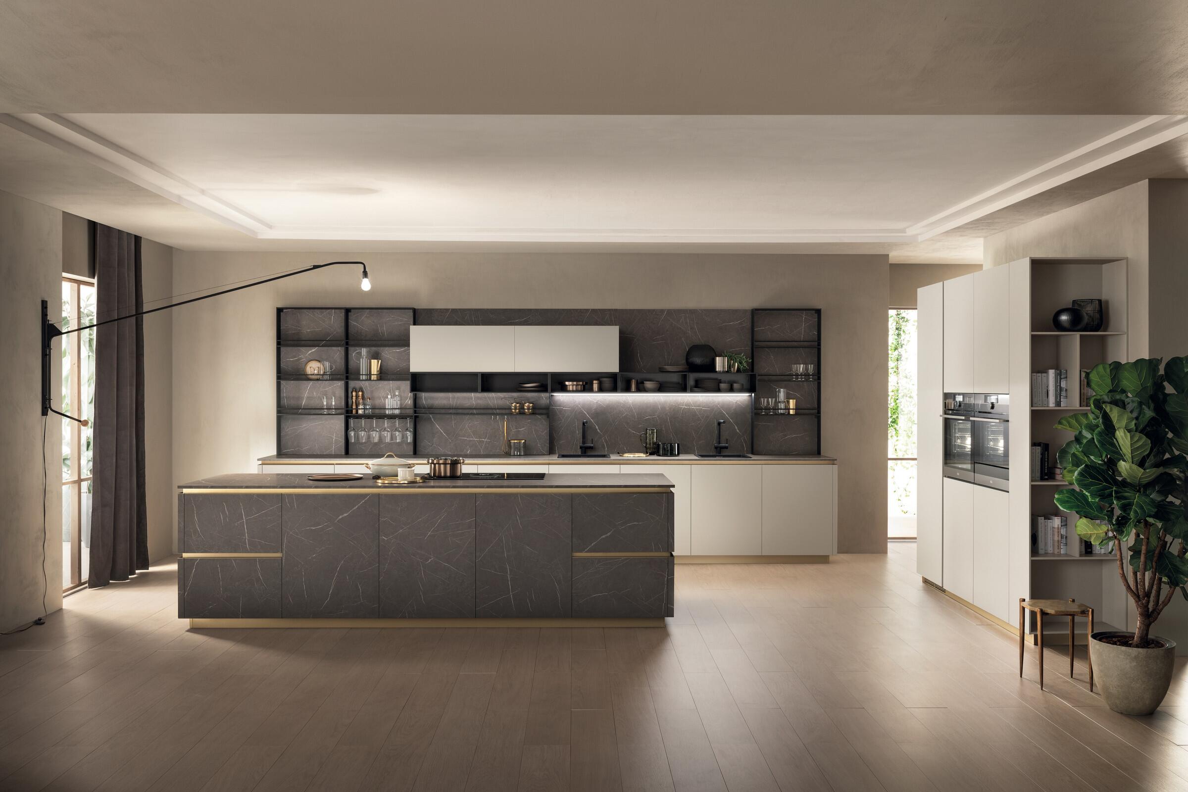 Scavolini DeLinea handle-free kitchen with brass-finish grip profiles and plinth