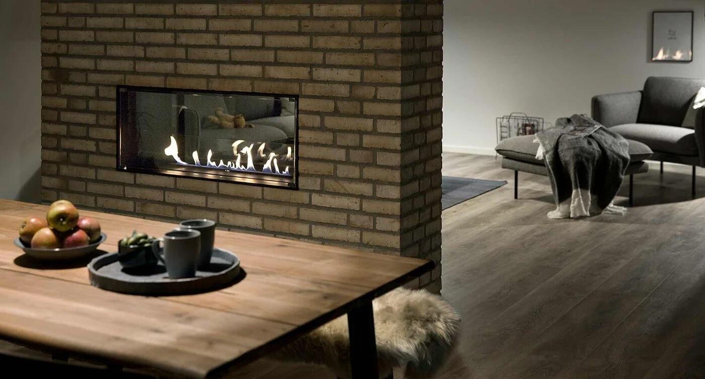 Montreal see-through fire in a brick wall between living and dining rooms