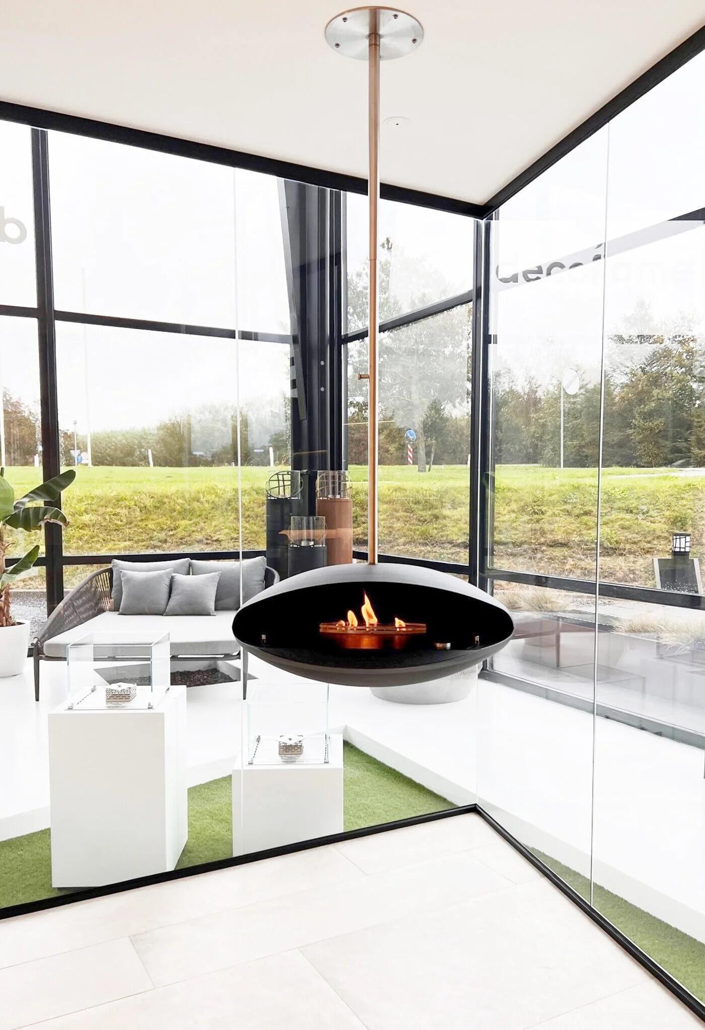 Espoo ceiling-hung fire in a glass corner room