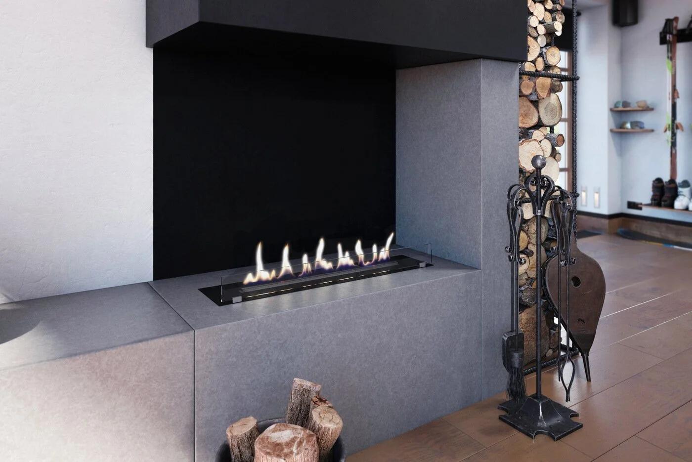 Denver F3 burner in a grey fireplace with a log store alongside