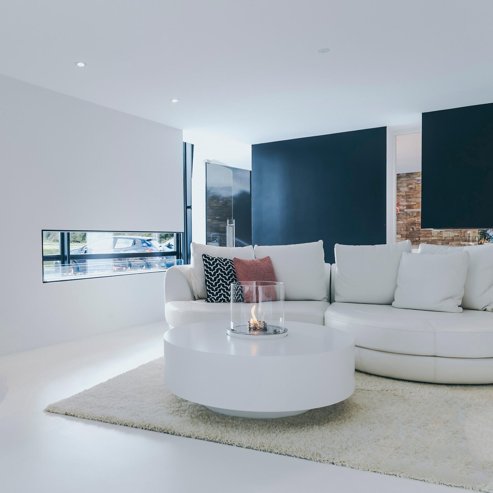 Denver Round bio-ethanol fire in a round white coffee table in a contemporary lounge