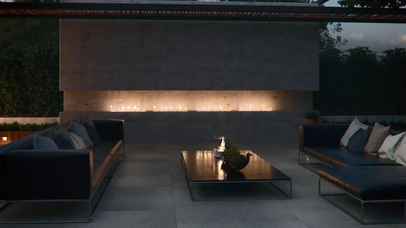 Outdoor burner in a long garden wall behind an outdoor lounge