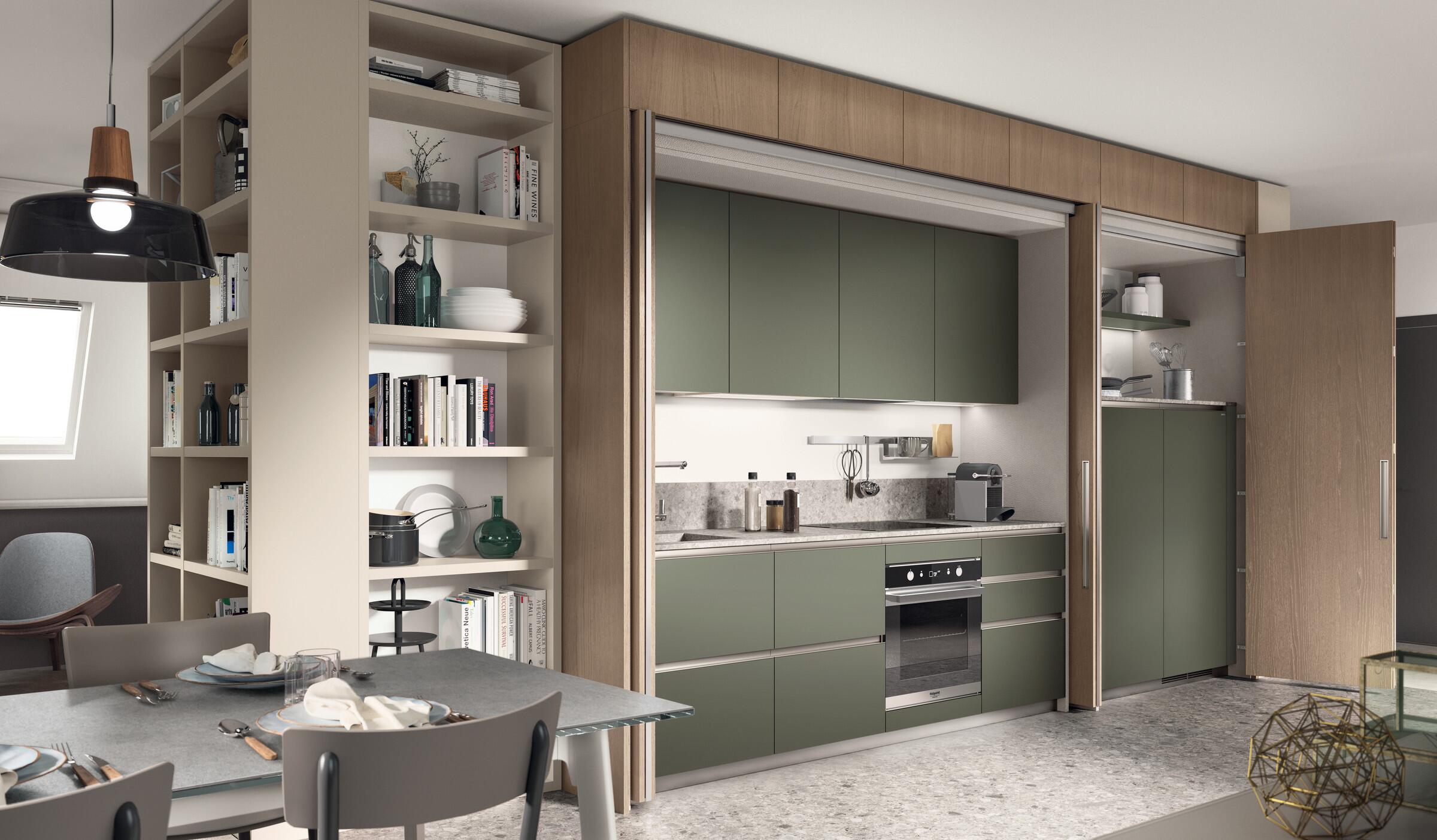Scavolini Boxi kitchen with sage green units, open shelving and a dining area