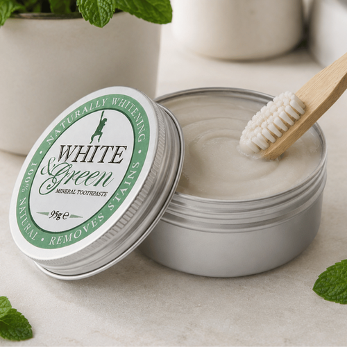 White and green mineral toothpaste with a bamboo toothbrush