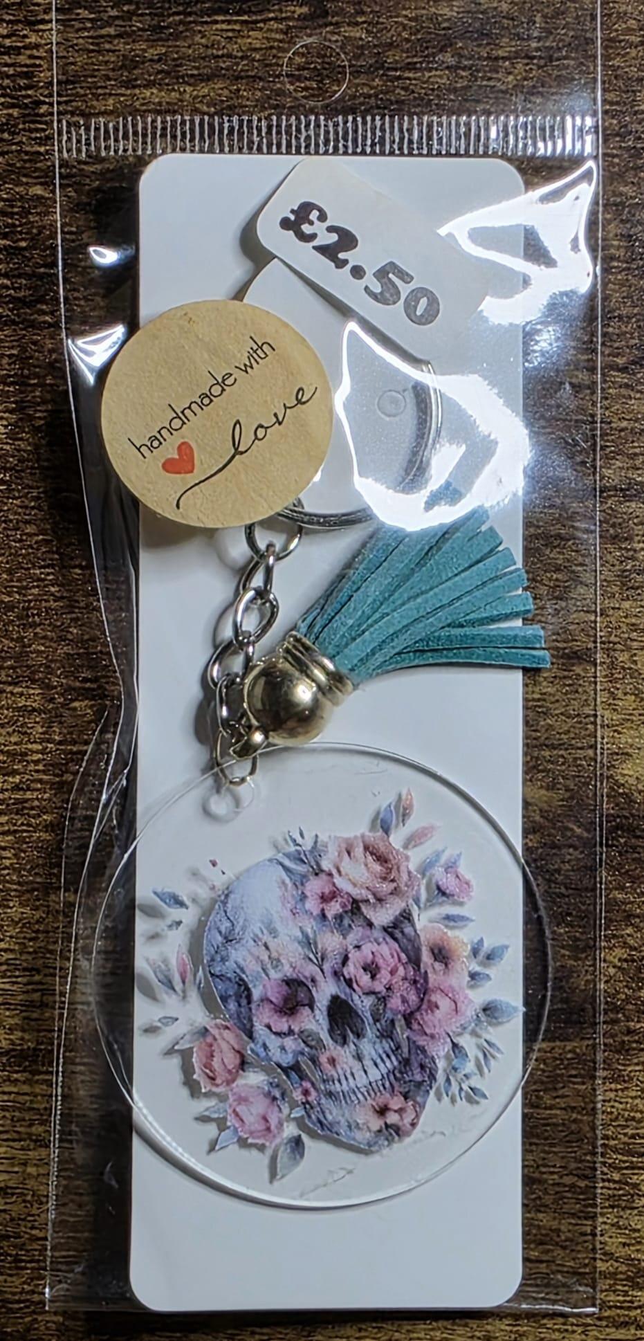 skull face round teal tassel