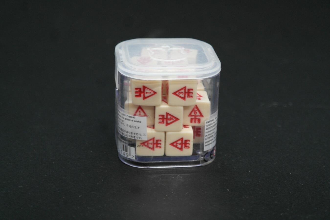 Close-up Howling Banshee symbol engraved dice
