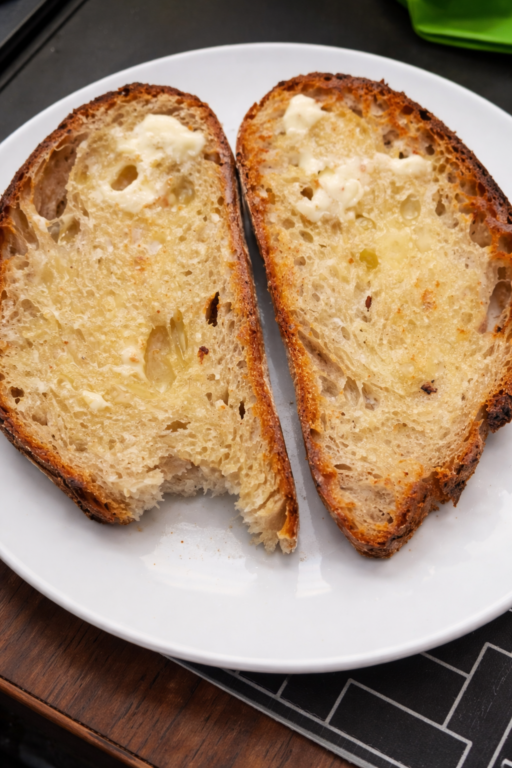 2 slices of buttered sour dough bread with butter melted in.