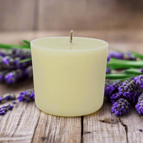 White candle refill on a wooden surface with lavender flowers