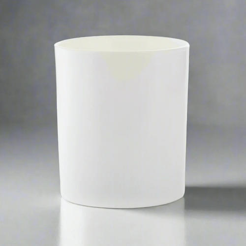 Reffilable candle jar made from gloss white glass in studio setting