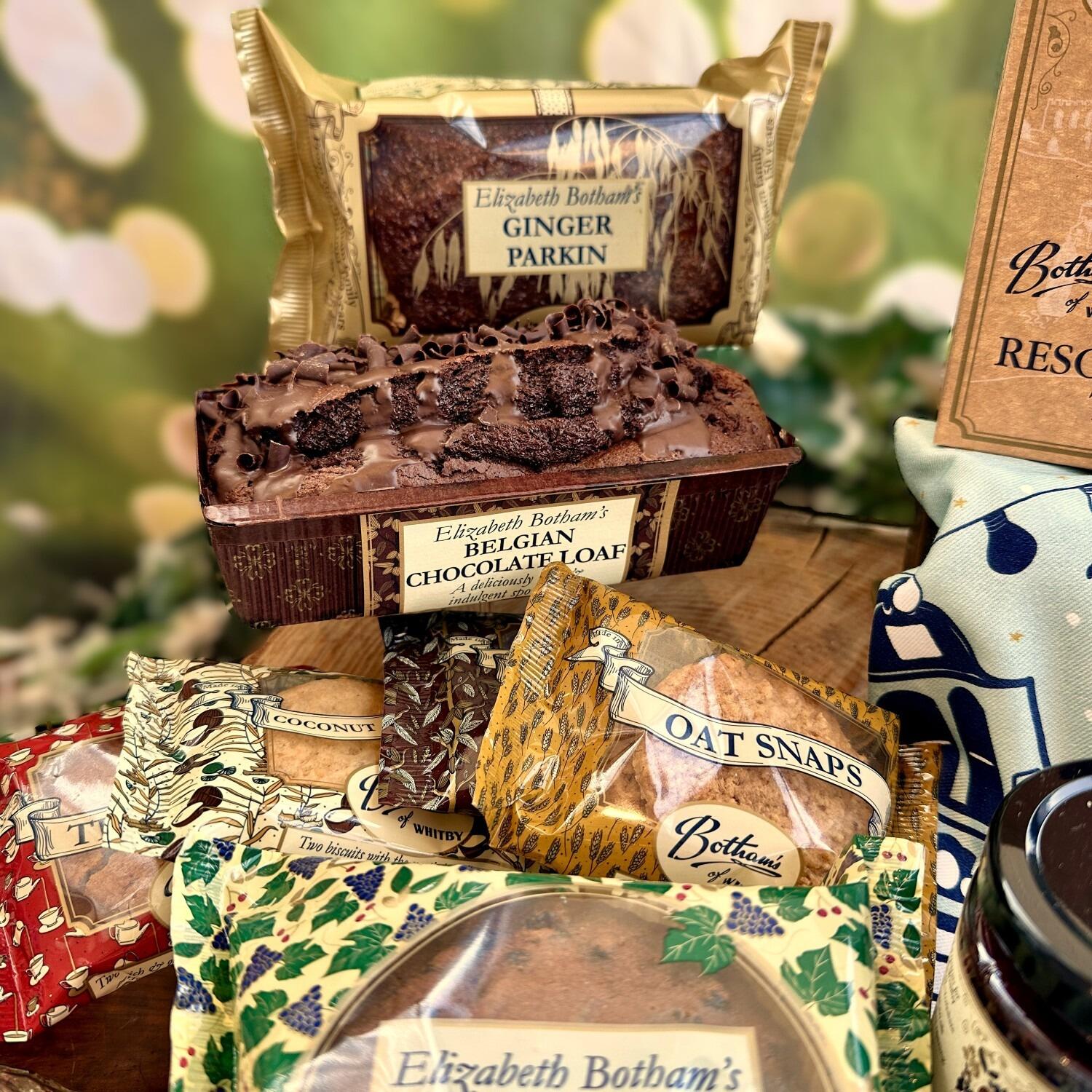 ‘Season’s Greetings Gift Box’ festive food hamper is a delightful Christmas hamper containing delicious bakes from Botham's of Whitby bakery, with a focus on Ginger Parkin, Belgian Chocolate Loaf, Elizabeth Botham Fruit Cake, and a selection of twin pack biscuits. This is an exquisite Yorkshire Christmas food hamper by post from Botham’s iconic Whitby bakery.
