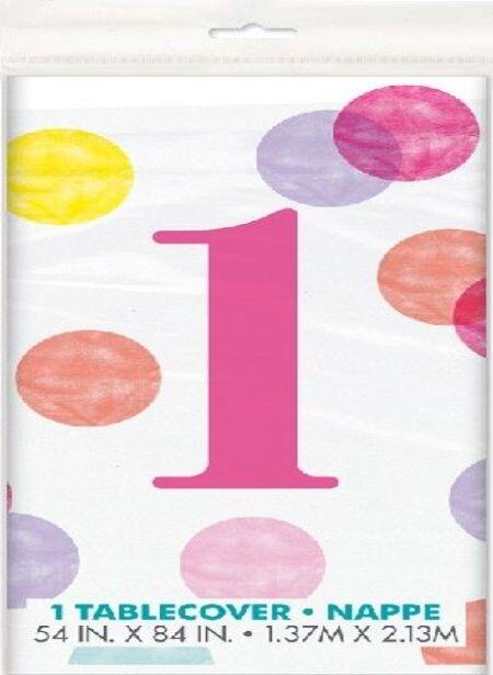 A plastic Pink Dots 1st Birthday table cover