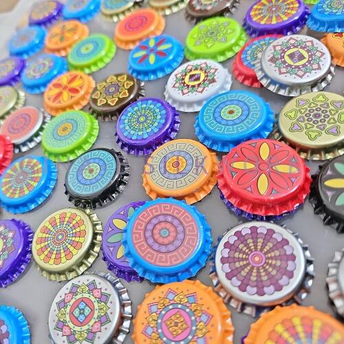 bottle caps with printed mandala designs