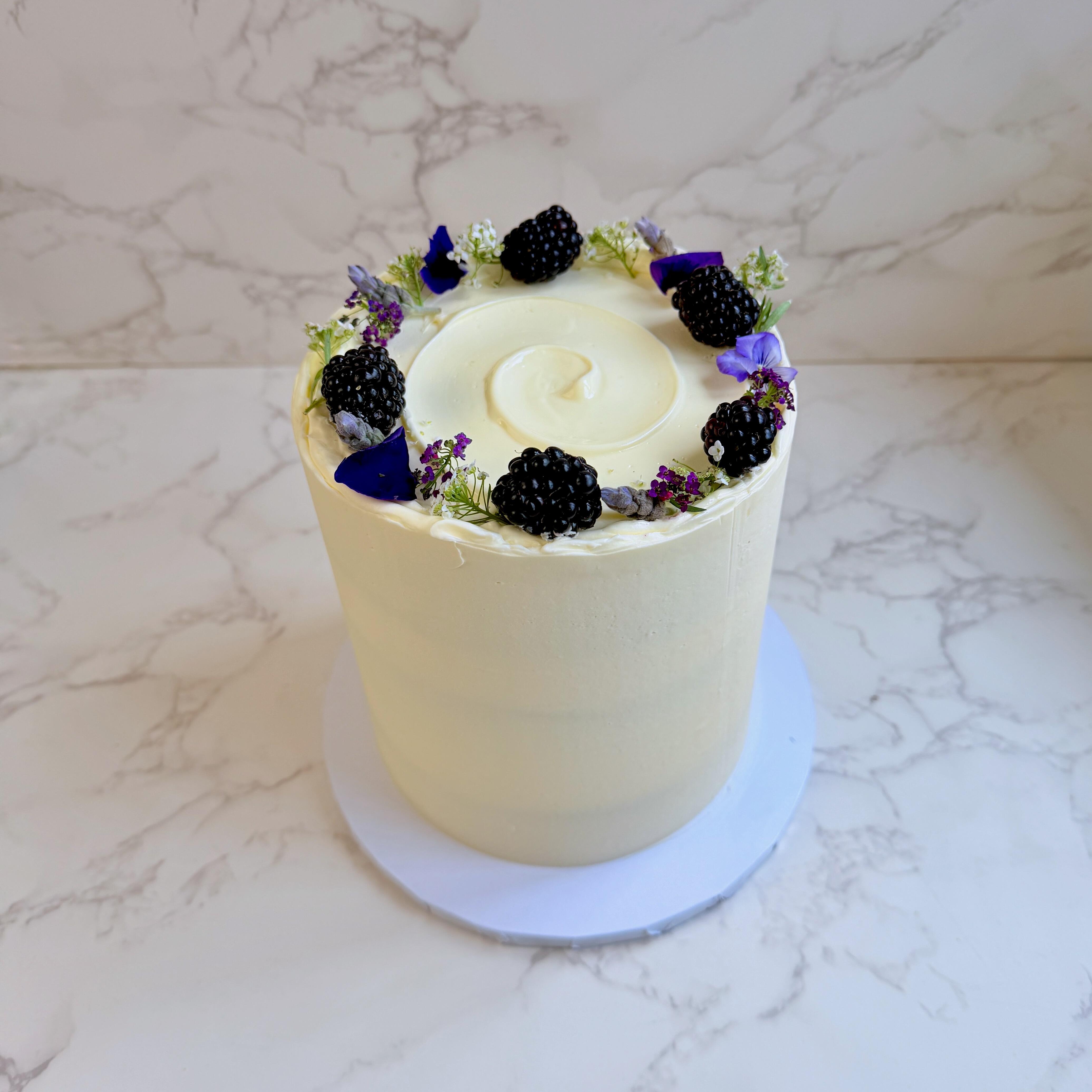 Blackberry elderflower cake close up, blackberry buttercream finish