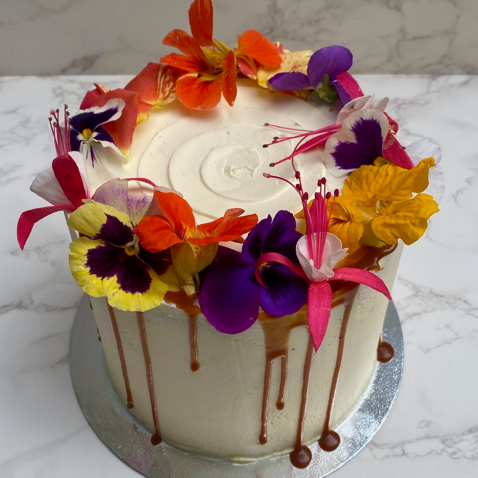 Chocolate cake with salted caramel buttercream and peanuts