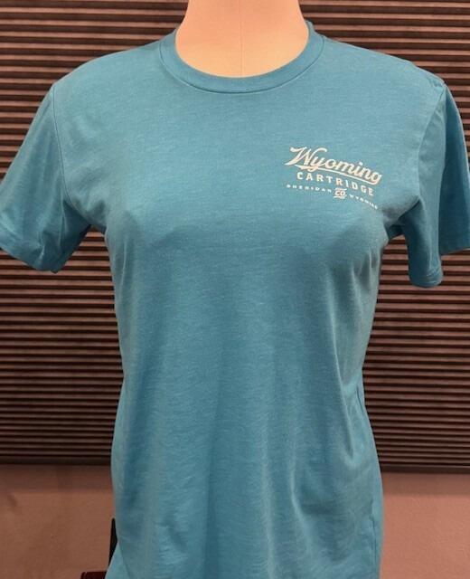 front of teal blue t-shirt with Wyoming Cartridge Co logo on the upper left side