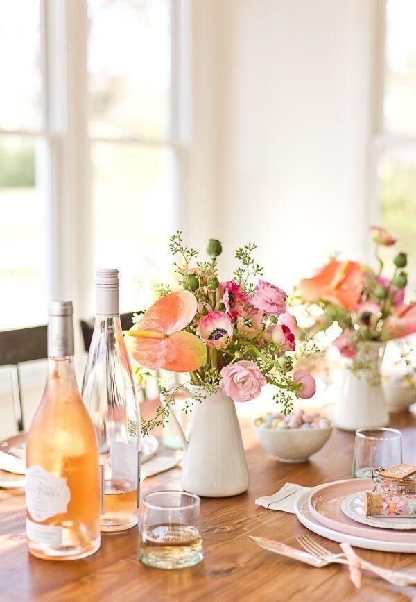 Vases of pretty flowers at a Dinning Table.