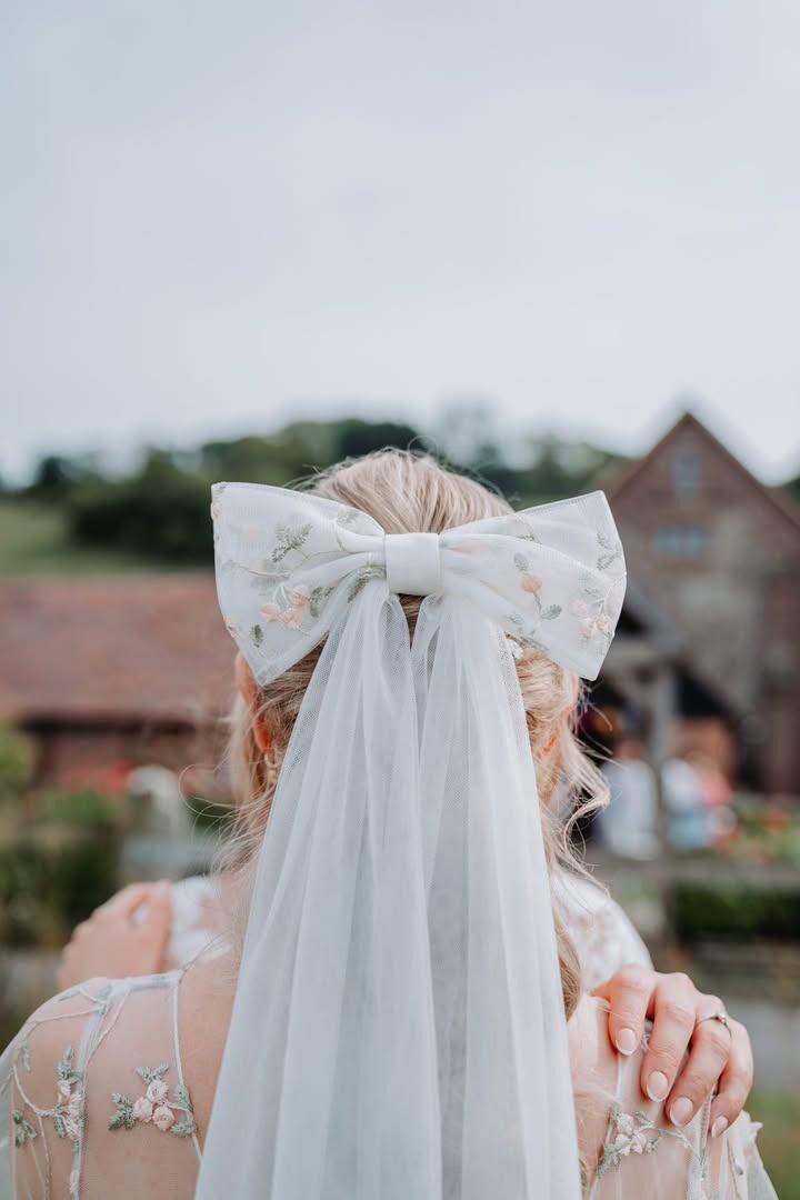 a bow veil made from matching blossom lace