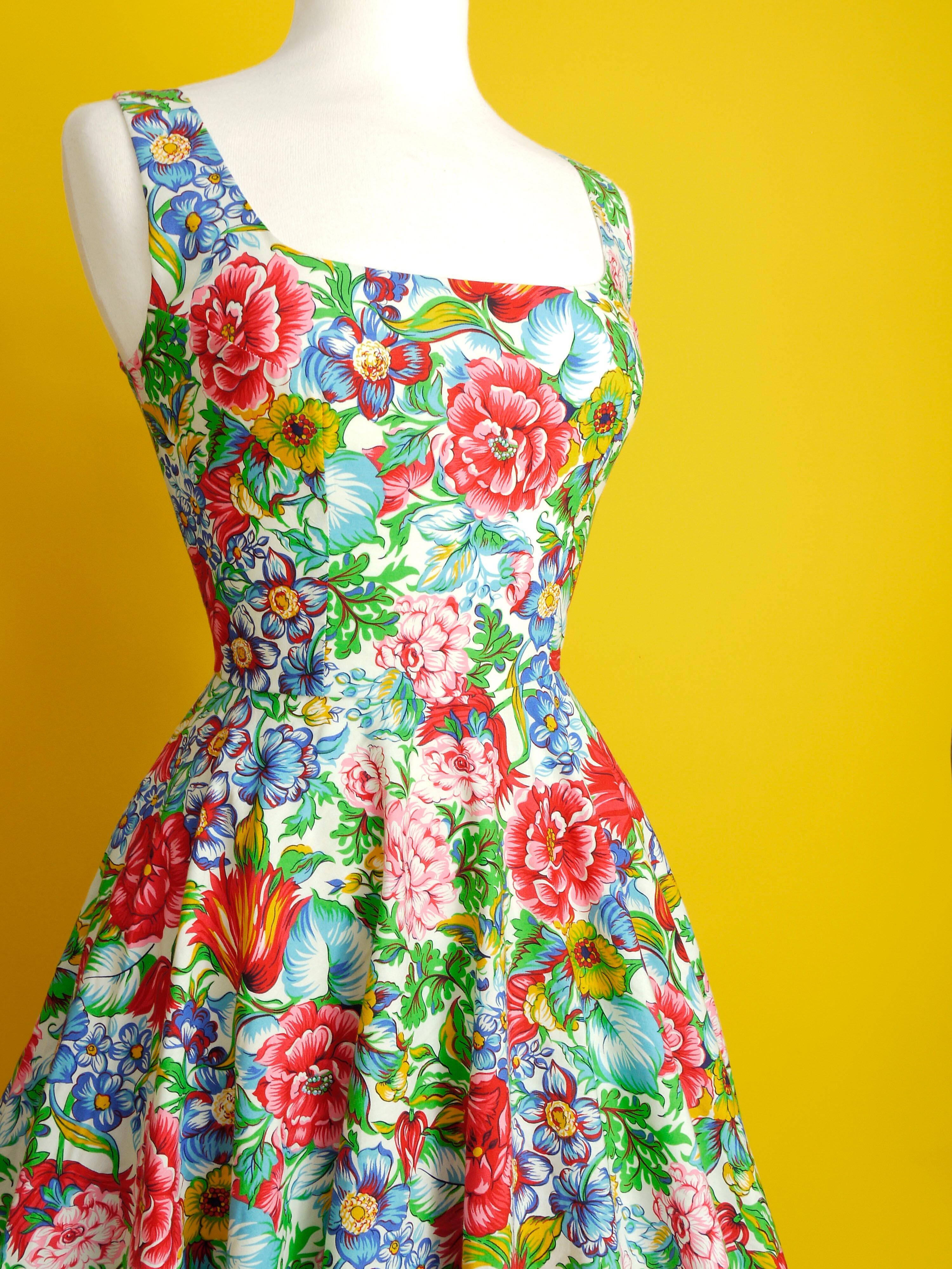 A multi coloured floral dress with a neatly fitted bodice and full skirt