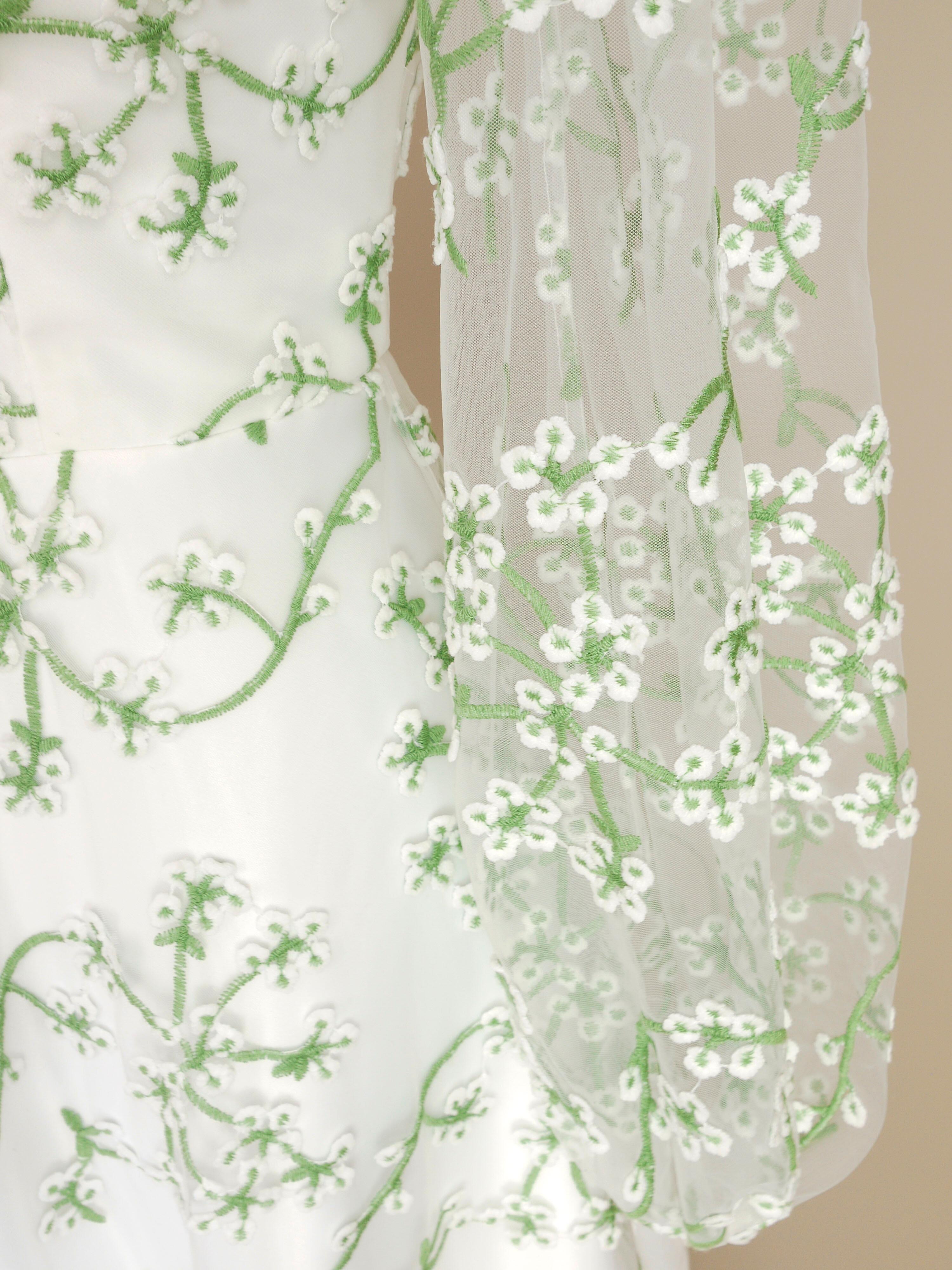 a close up of the balloon cuff on the long lace sleeves of the jasmine wedding dress
