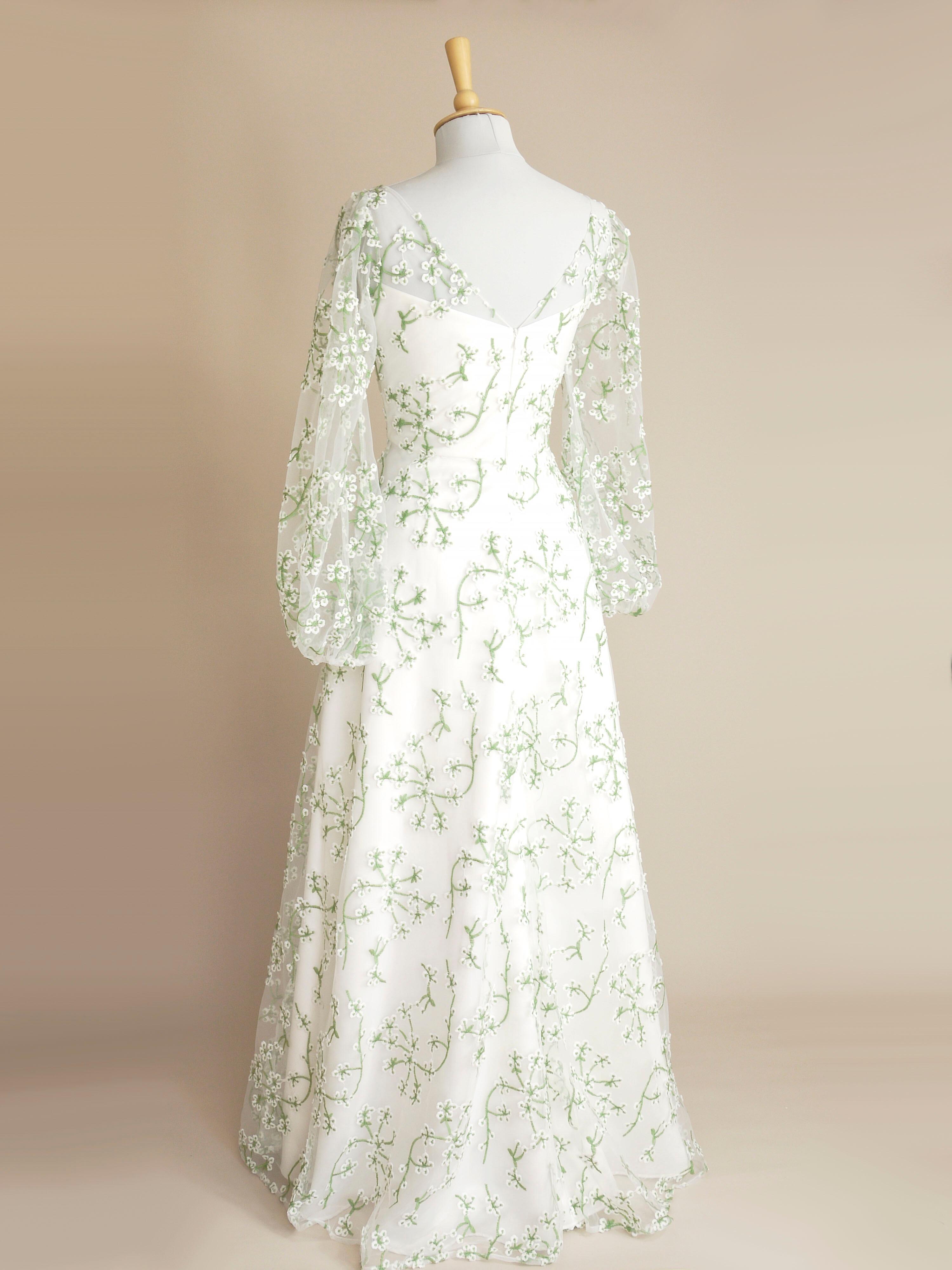 a back view of the jasmine green lace wedding dress