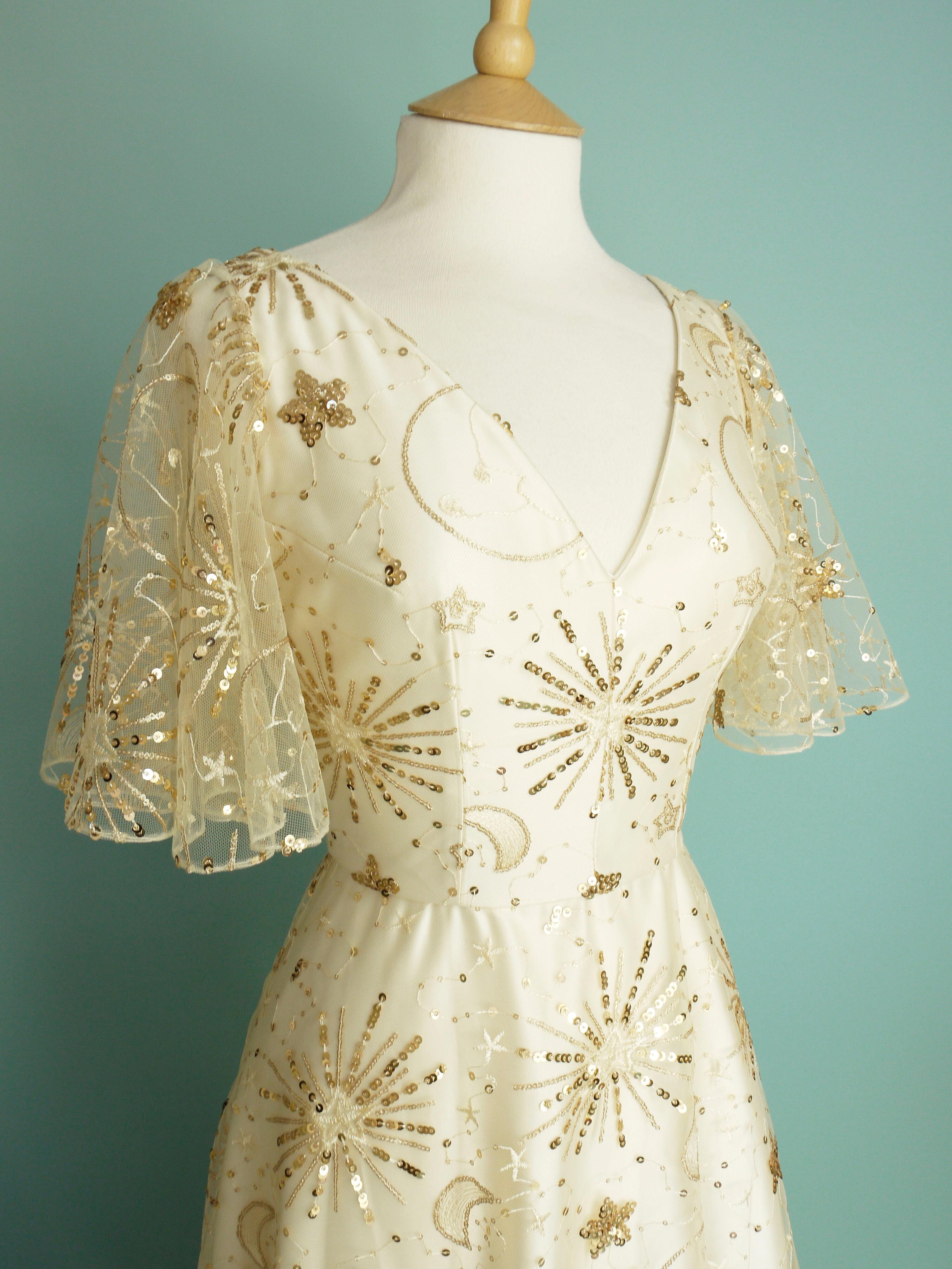 Wedding dress made in gold sparkly celestial lace over ivory duchess satin