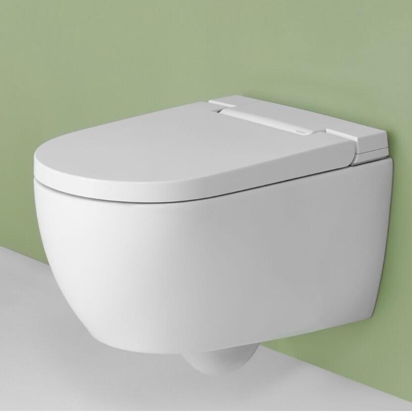 Geberit AquaClean Alba wall hung shower toilet in a greenbathroom