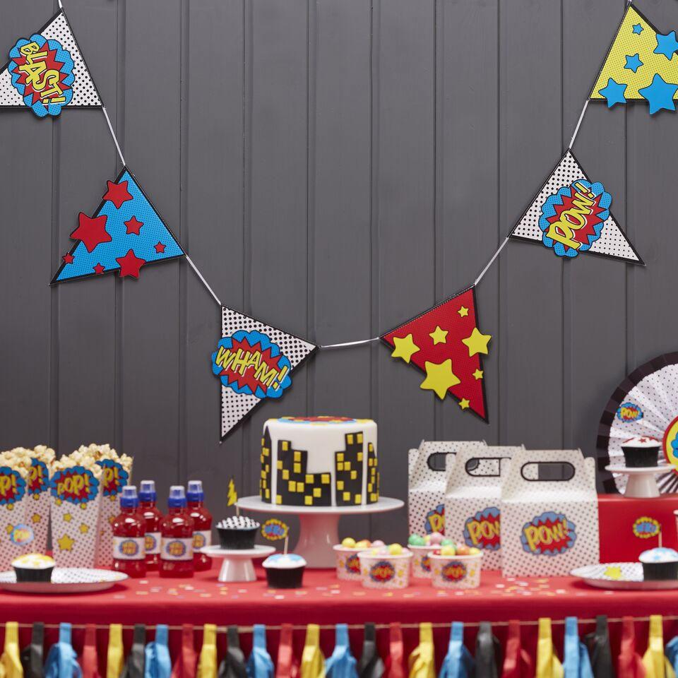 Part setting featiuring Comic Superhero Bunting Decoration CS909 by Ginger Ray and available from thye collection here at Karnival Costumes online party shop