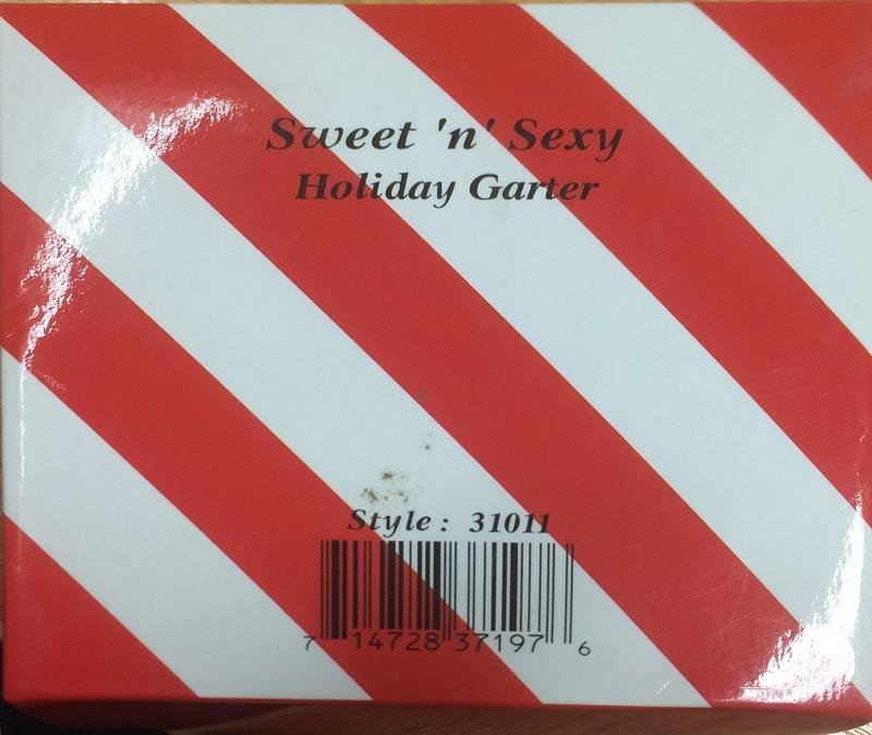 Red Lace Leg Garter with Bow and Candy Cane by Leg Avenue 31011 available in the UK here at Karnival Costumes online party shop - image shows marking to rear of box