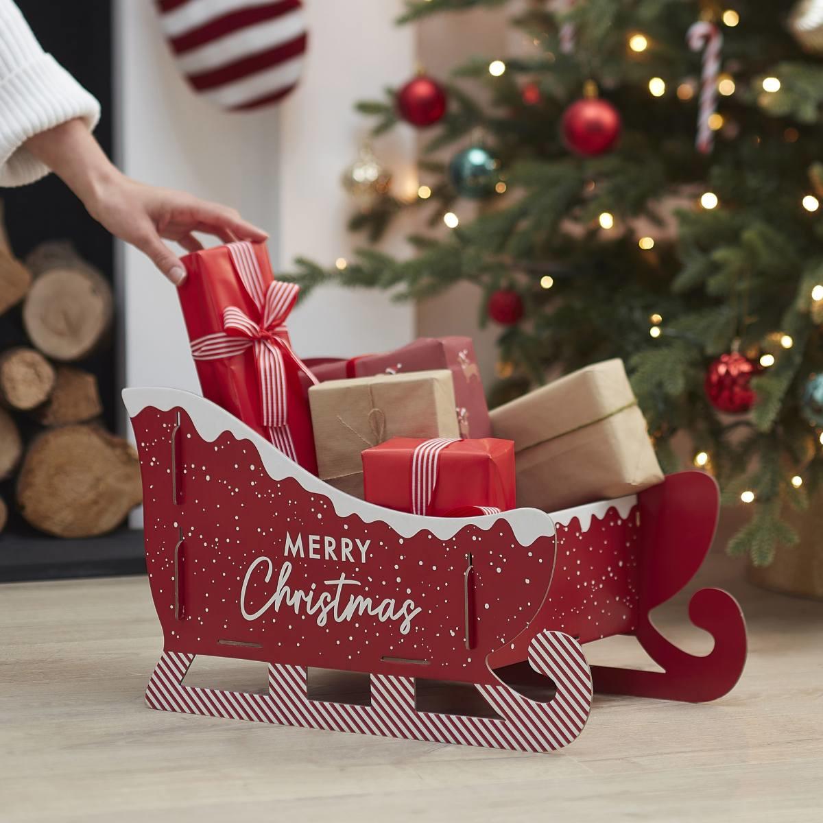 Lifestyle shot of our 48cm long Christmas Present Sleigh by Ginger Ray MRY-122 available here at Karnival Costumes online Christmas party shop