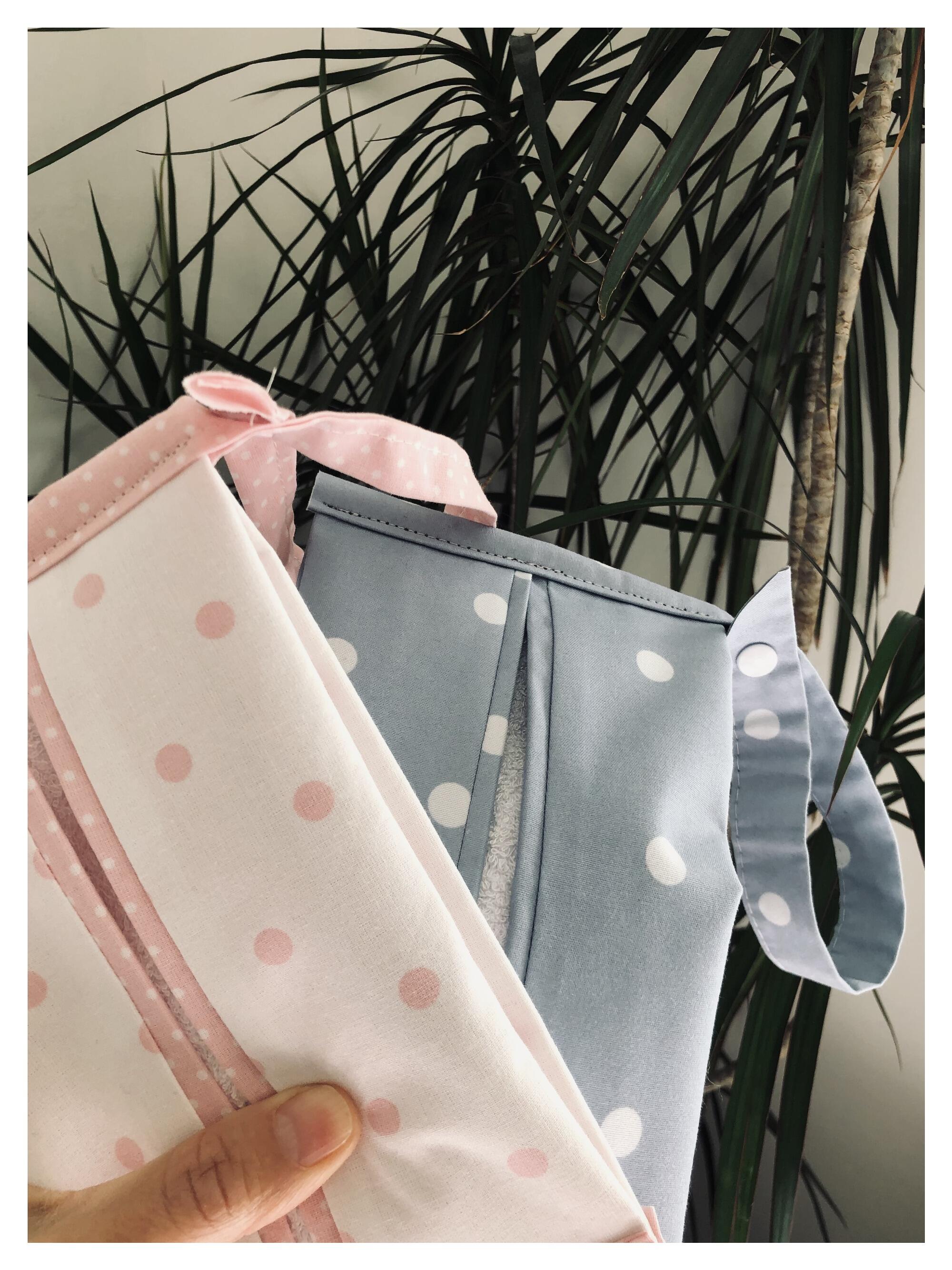 wipes holders filled with wipes look white and pink dots and blue and white dots