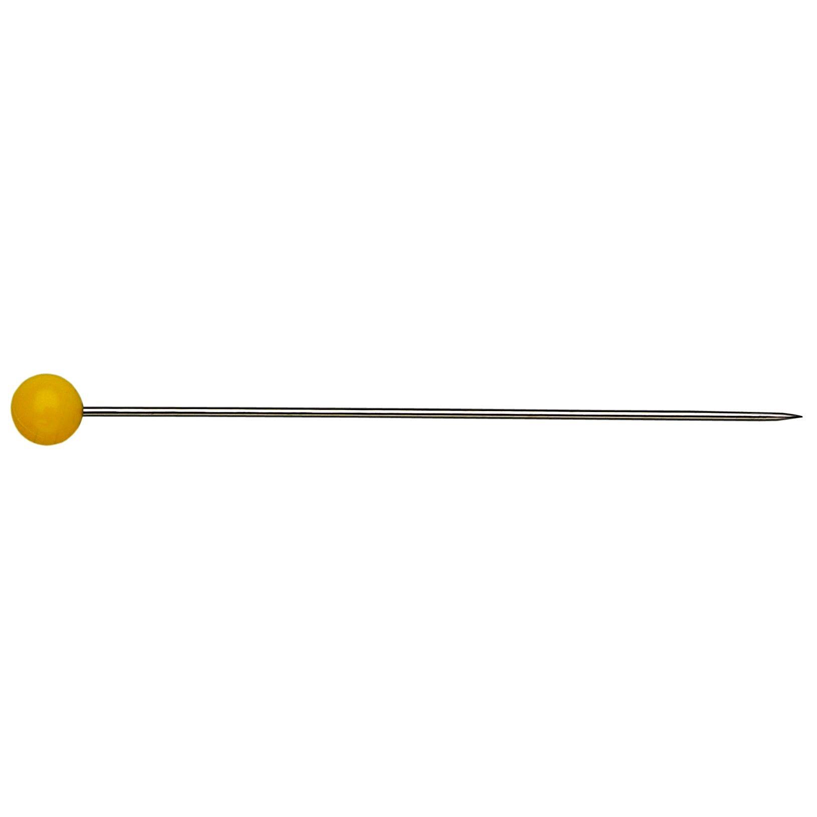 A close up look of a yellow plastic headed pin made by Prym