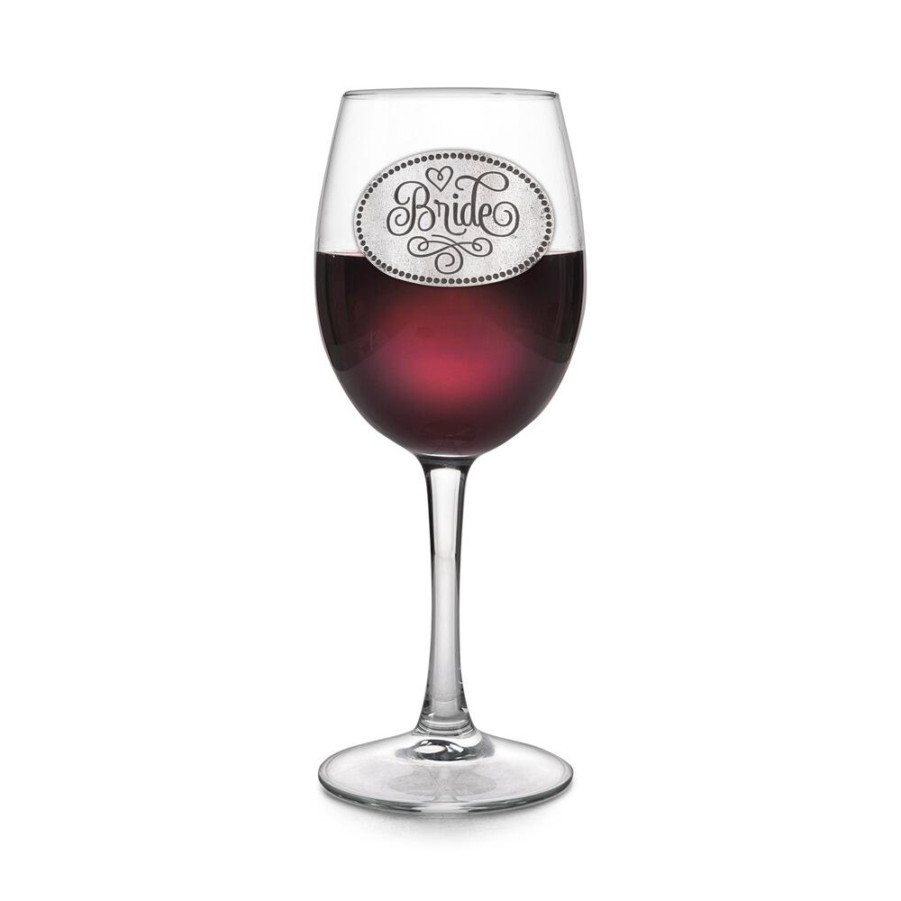 Wine glass with handcrafted pewter Bride badge filled with red wine