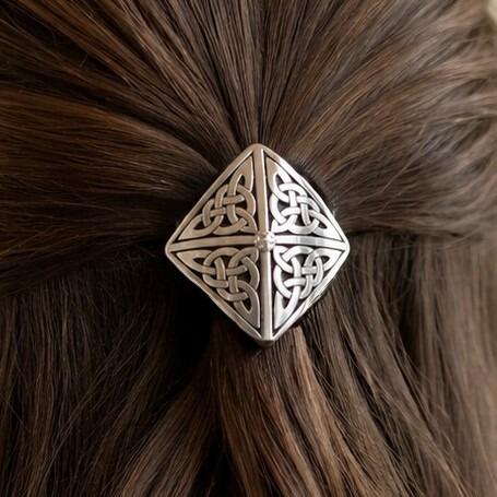 Diamond-shaped pewter Celtic hair bobble featuring four quadrants of intricate trinity knotwork meeting at a small central bead accent