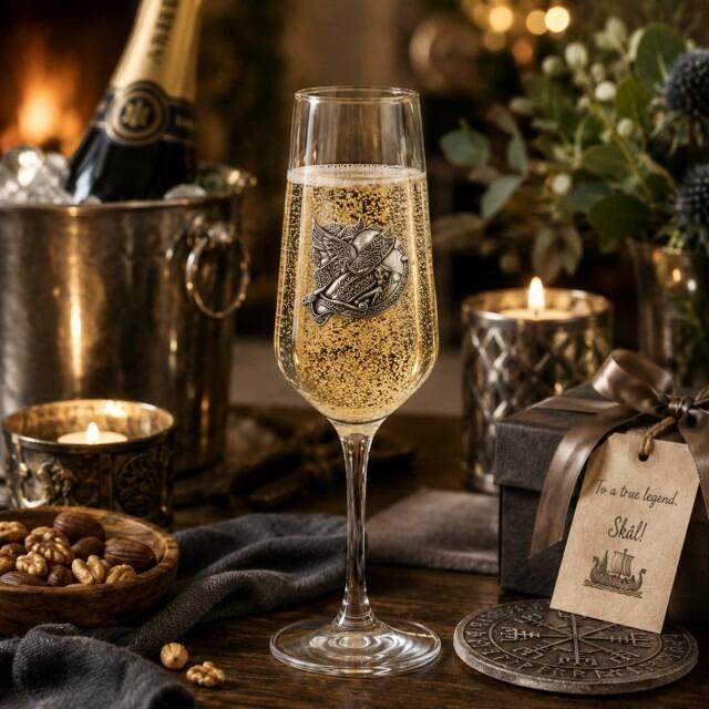 A Champagne Flute with a Pewter Viking badge on the front, filled with Champagne