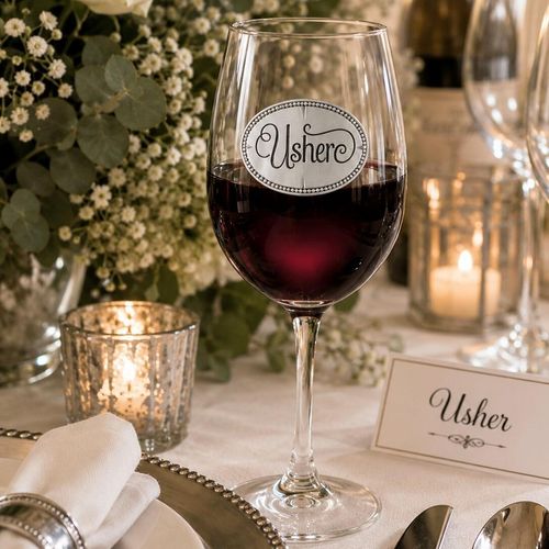 Wine glass with handmade pewter usher badge filled with red wine
