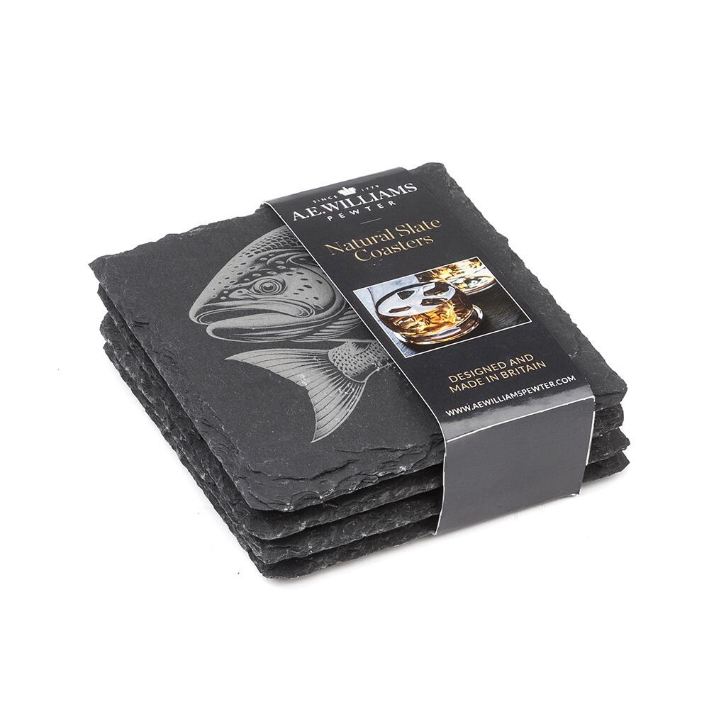 The top coaster features an engraved Salmon design. A product label wraps around the stack, displaying the brand name, product type 'Natural Slate Coasters', and an image of a Stag on a coaster. The label states 'Designed and Made in Britain' and includes the company website.