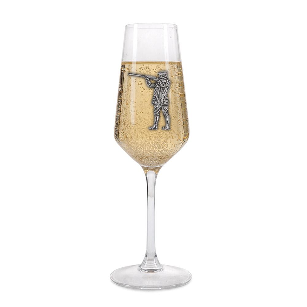 A Champagne Flute with a Pewter Shooting Man badge on the front, filled with Champagne