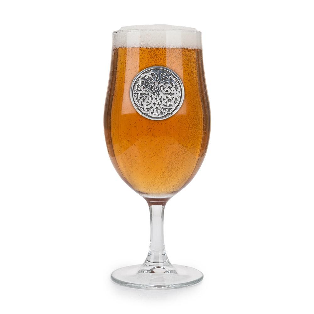 A Stemmed Pint Beer Glass with a Pewter Never Ending Knot badge on the front, filled with Beer