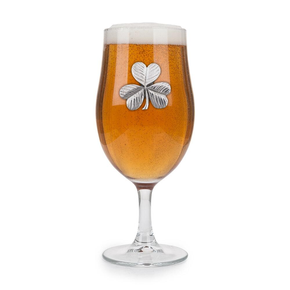 A Stemmed Pint Beer Glass with a Pewter Shamrock badge on the front, filled with Beer