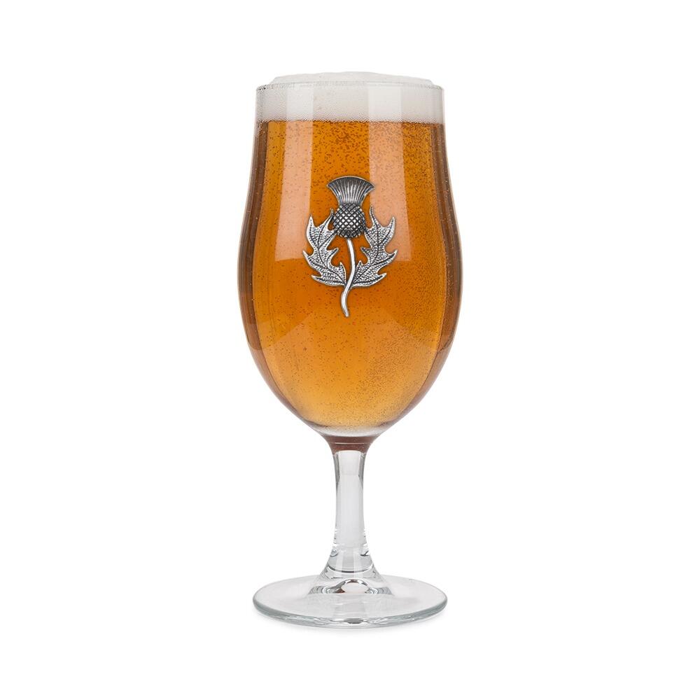 A Stemmed Pint Beer Glass with a Pewter Thistle badge on the front, filled with Beer