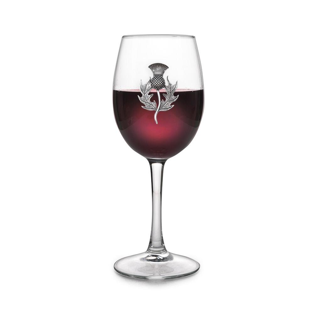 Wine glass with handmade pewter thistle badge filled with red wine