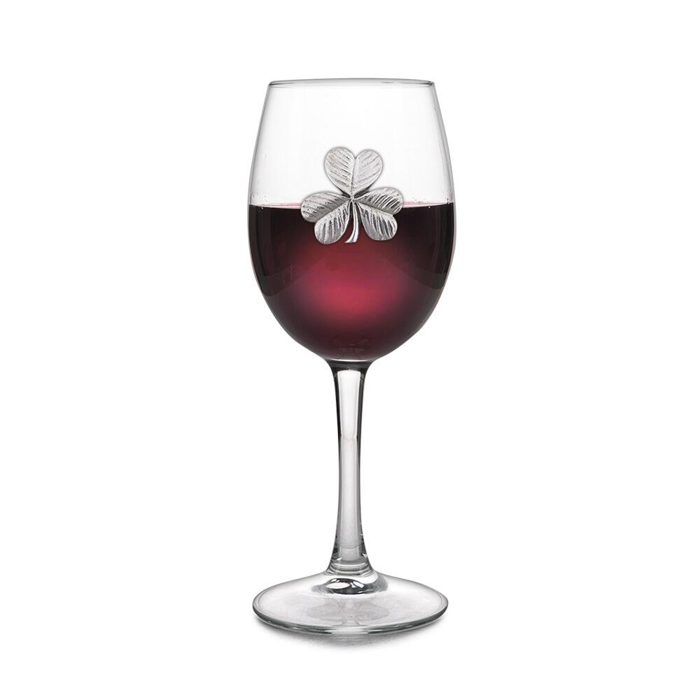 Wine glass with handmade pewter shamrock badge filled with red wine