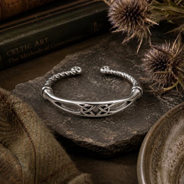 Celtic knotwork pewter torc bangle with twisted band and scroll terminals