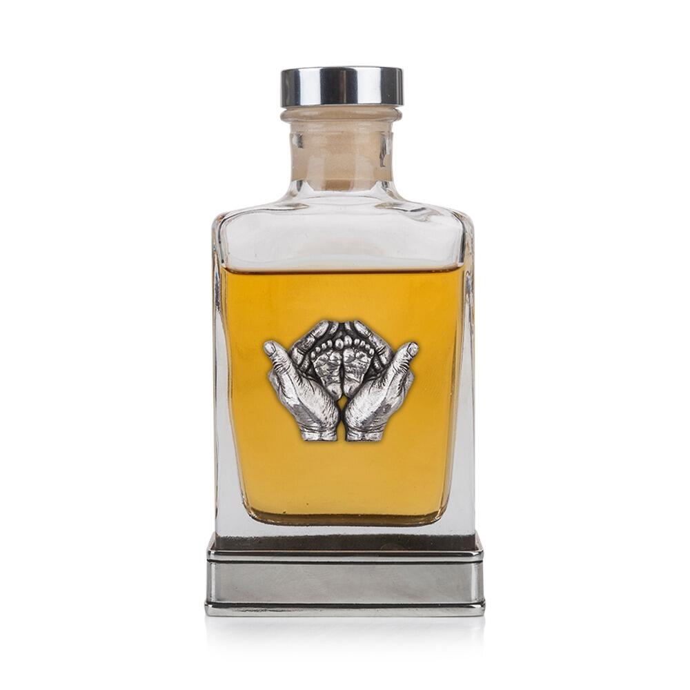 Handcrafted glass hip flask with pewter base featuring detailed hands and feet emblem on front