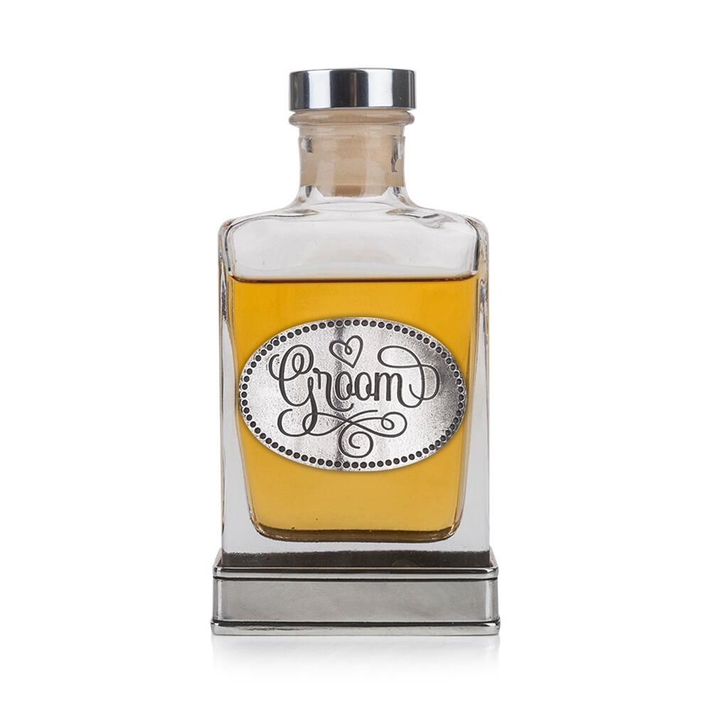 Handcrafted glass hip flask with pewter base featuring detailed groom emblem on front