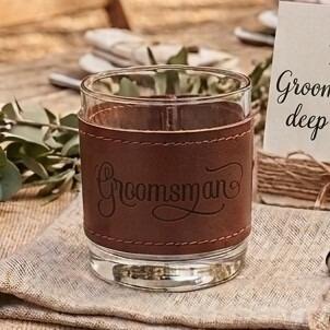 Glass tumbler wrapped in a brown stitched leather sleeve engraved with the word "Groomsman" in elegant script